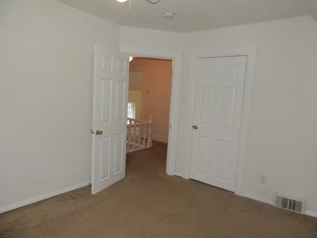 a view of a room with a hallway