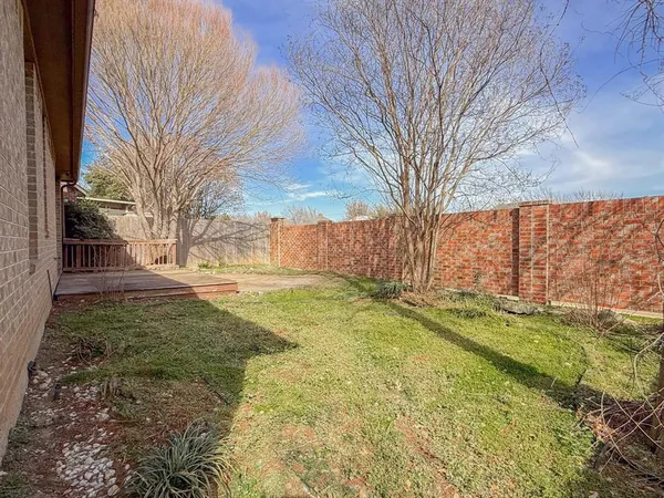 a view of yard with swimming pool