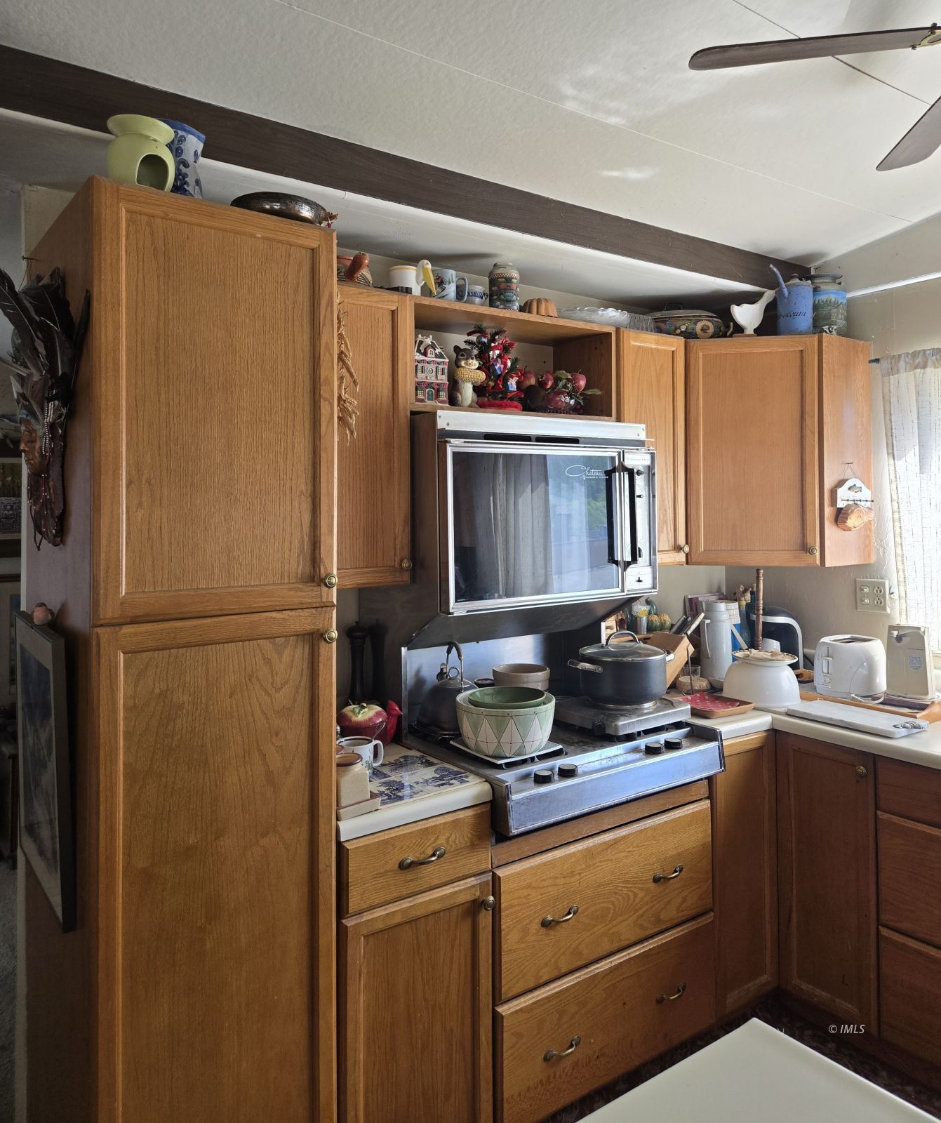 700 Glacier Lodge Road, Unit 12 Big Pine, CA 93513 - Photo 4 of 8 a kitchen with a refrigerator and a sink