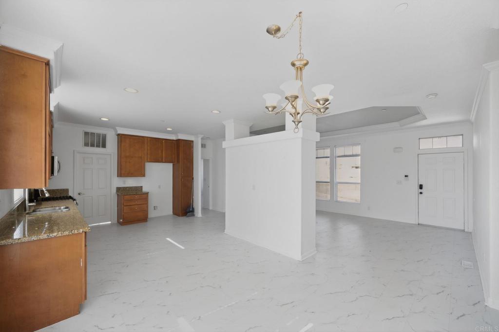 37455 Brandon Road Anza, CA 92539 - Photo 11 of 26 a living room with furniture and a chandelier