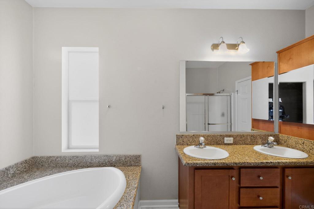 37455 Brandon Road Anza, CA 92539 - Photo 15 of 26 a bathroom with a granite countertop sink and a mirror