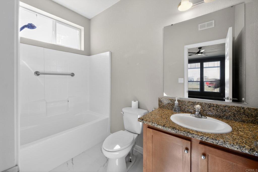 37455 Brandon Road Anza, CA 92539 - Photo 16 of 26 a bathroom with a granite countertop sink toilet and shower