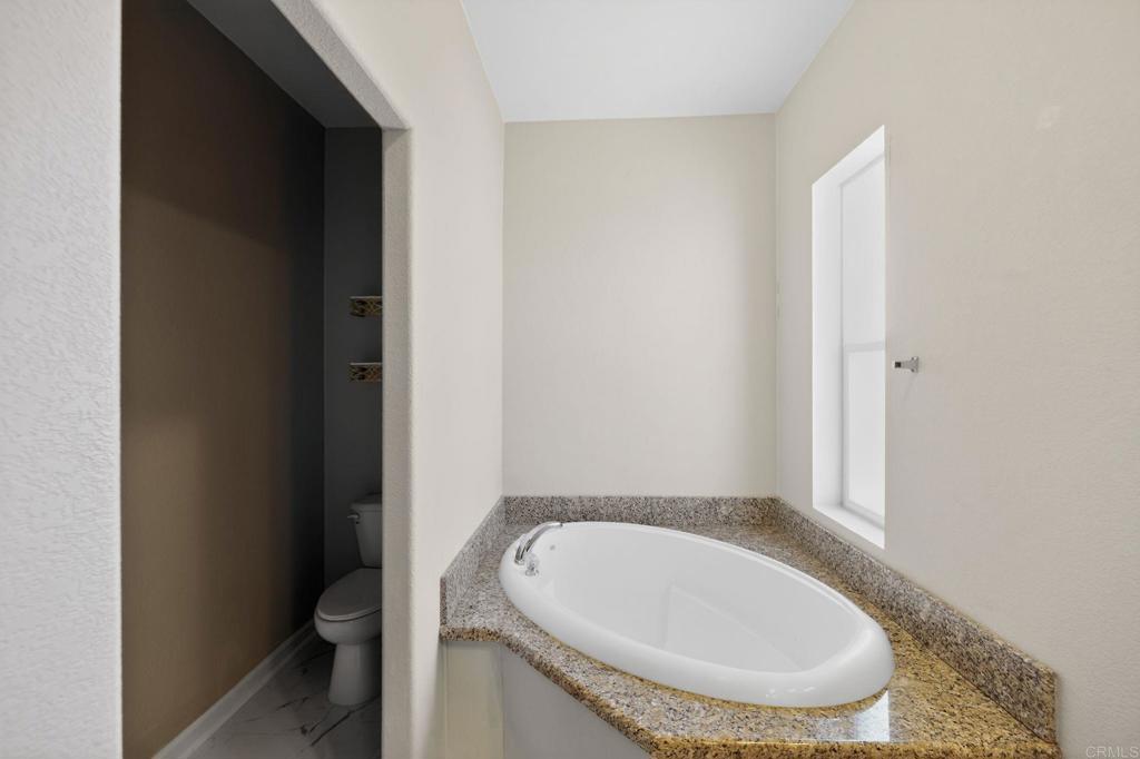 37455 Brandon Road Anza, CA 92539 - Photo 17 of 26 a bathroom with a granite countertop sink and a mirror