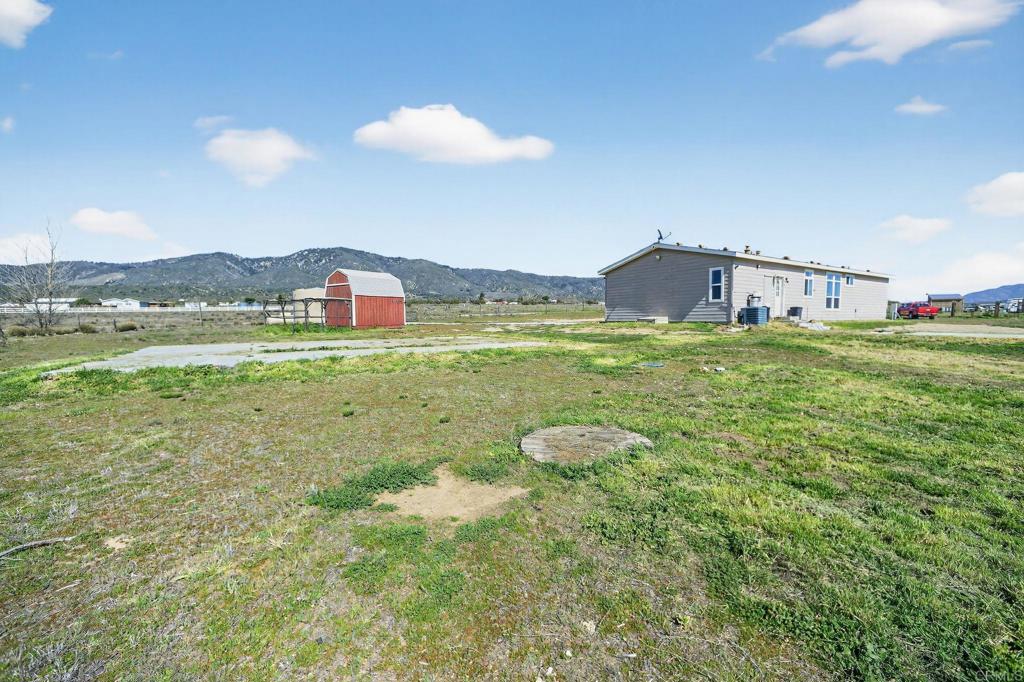 37455 Brandon Road Anza, CA 92539 - Photo 3 of 26 a view of a house with a yard and a large tree