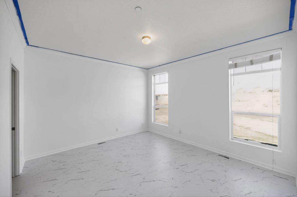 37455 Brandon Road Anza, CA 92539 - Photo 9 of 26 a view of an empty room with a window