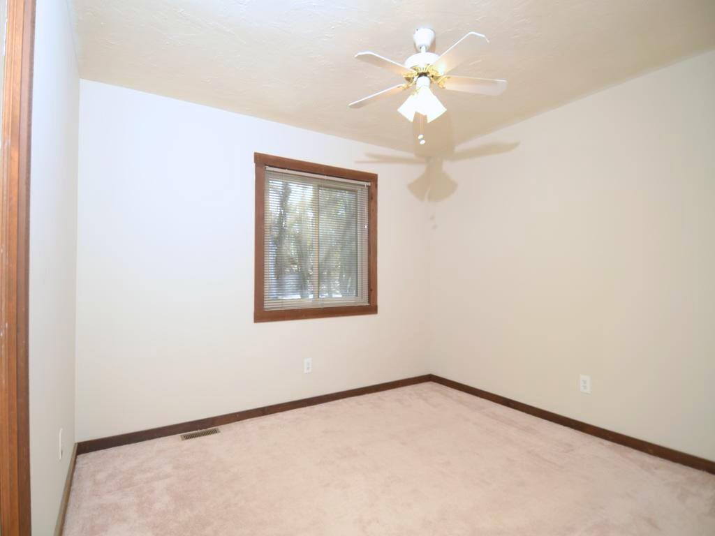 1179 Justice Drive Kennesaw, GA 30152 - Photo 19 of 30 an empty room with a window and a chandelier fan