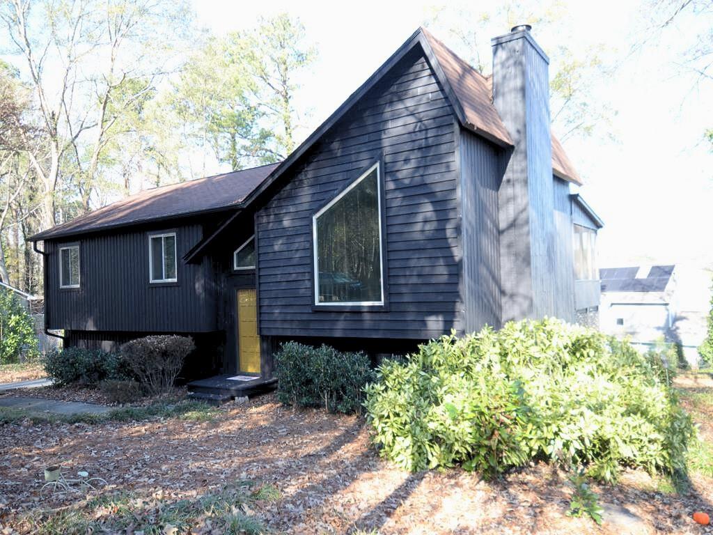 1179 Justice Drive Kennesaw, GA 30152 - Photo 2 of 30 a brick building with a yard