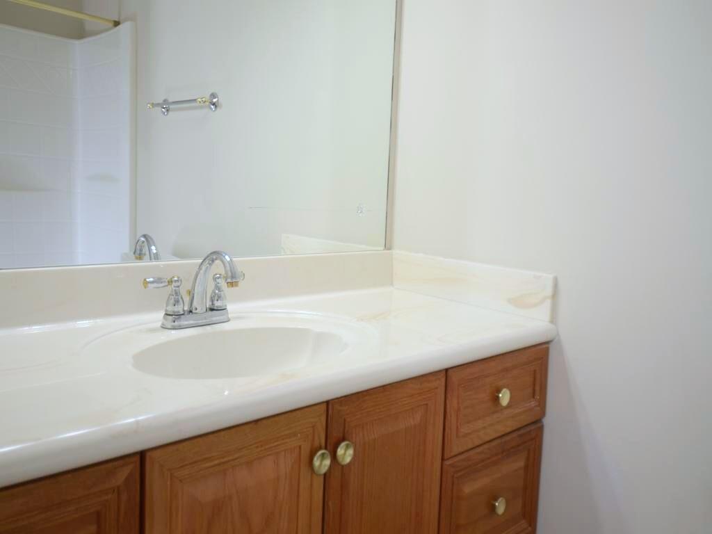 1179 Justice Drive Kennesaw, GA 30152 - Photo 21 of 30 a bathroom with a sink and a mirror