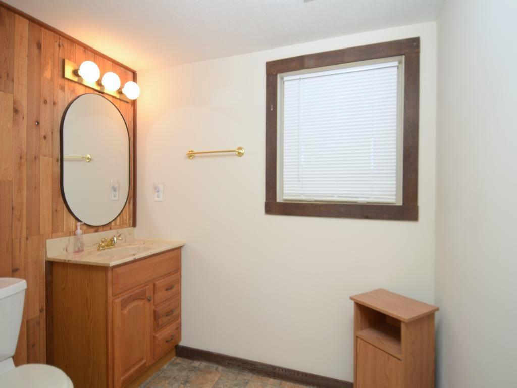 1179 Justice Drive Kennesaw, GA 30152 - Photo 25 of 30 a bathroom with a toilet a sink and a mirror