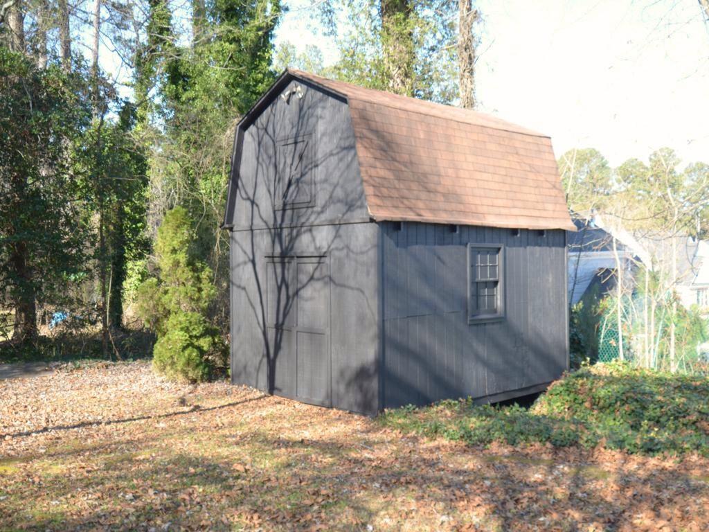 1179 Justice Drive Kennesaw, GA 30152 - Photo 28 of 30 a view of wooden house with a trees