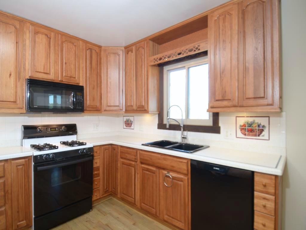 1179 Justice Drive Kennesaw, GA 30152 - Photo 10 of 30 a kitchen with a sink stove top oven and cabinets
