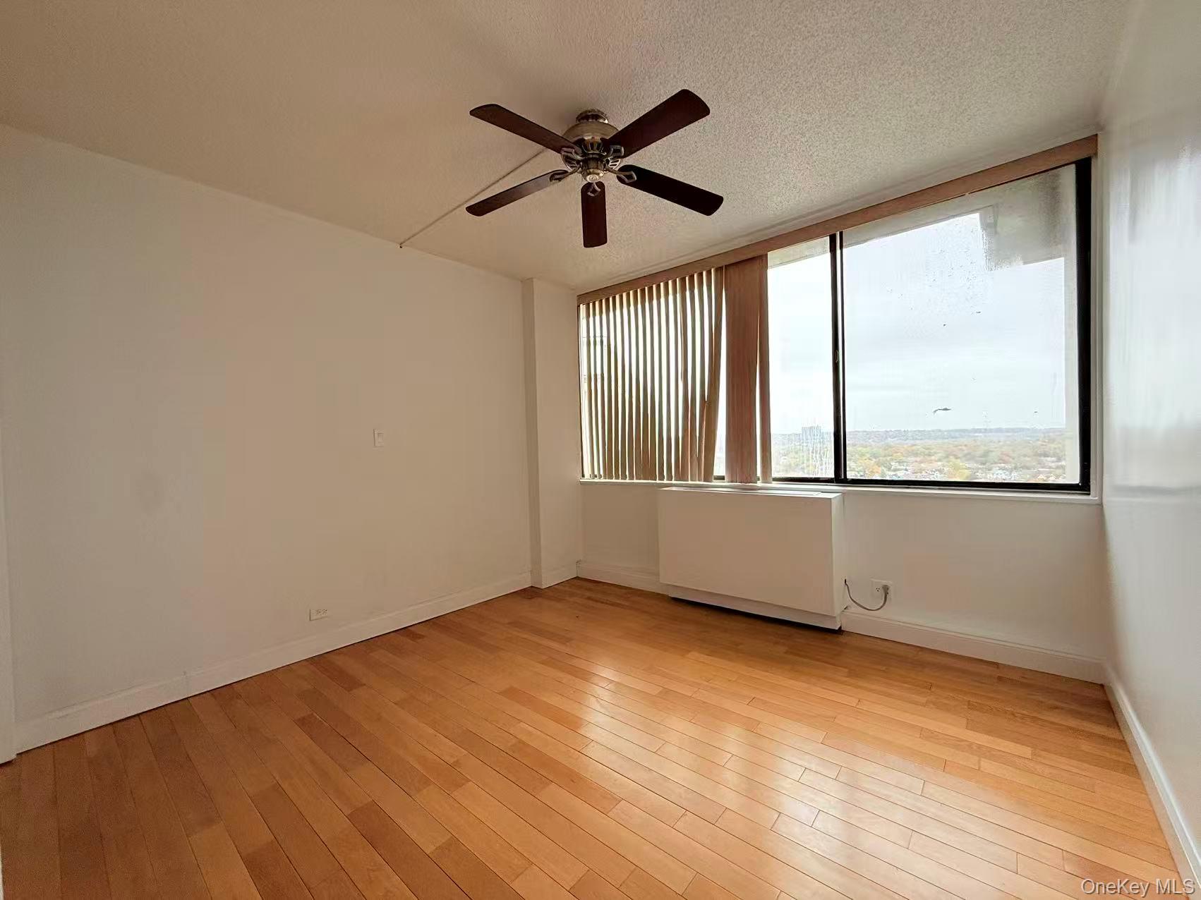 2 Bay Club Drive, Unit PHJ Queens, NY 11360 - Photo 10 of 17 a view of an empty room with a window