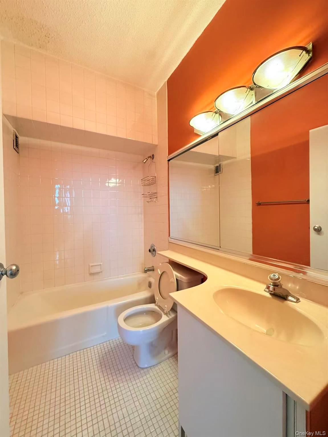 2 Bay Club Drive, Unit PHJ Queens, NY 11360 - Photo 8 of 17 a bathroom with a granite countertop sink and a mirror