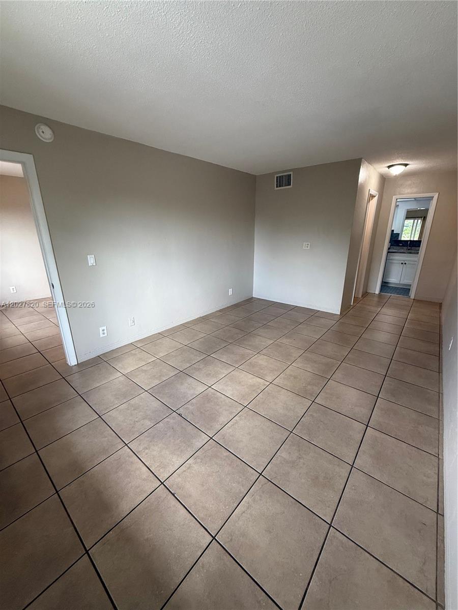 6841 Pembroke Road, Unit 15 Pembroke Pines, FL 33023 - Photo 15 of 16 a view of an empty room and staircase