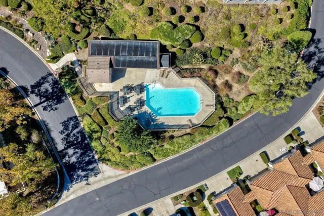 a wooden bench sitting in front of a building
