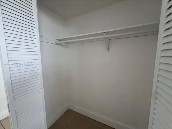 an empty room with a white door