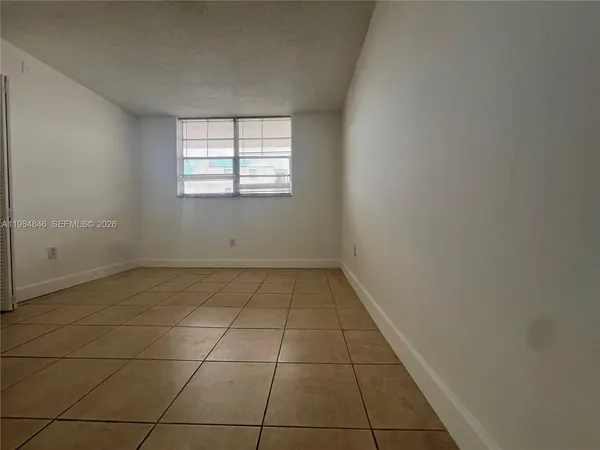 a bathroom with a toilet sink and vanity