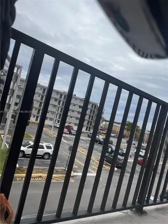 a view of a hallway with furniture