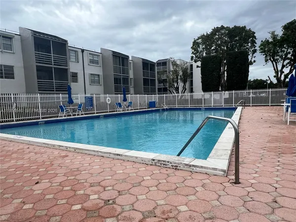 a view of a swimming pool with a chair