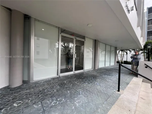 a view of a building and car parked