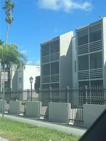a view of street with parked cars