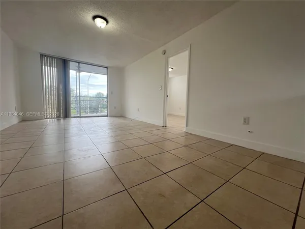a view of an empty room and window