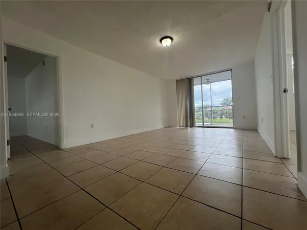 a view of a room that has a window in it