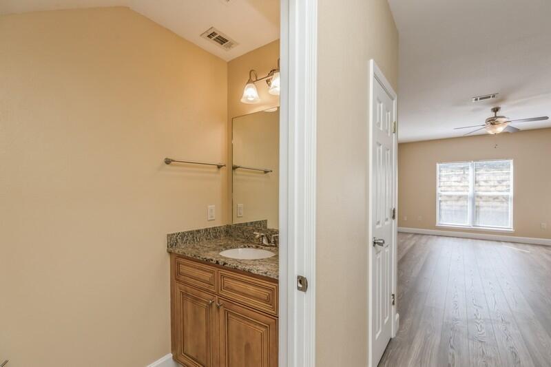 513 Arbor Lake Drive, Unit 513 Crestview, FL 32536 - Photo 16 of 37 a bathroom with a granite countertop sink and a mirror