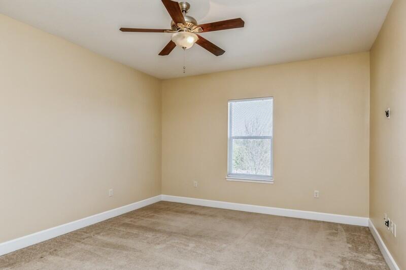 513 Arbor Lake Drive, Unit 513 Crestview, FL 32536 - Photo 18 of 37 an empty room with a window and a fan