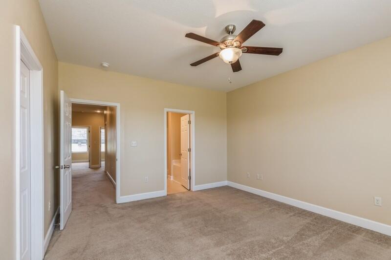 513 Arbor Lake Drive, Unit 513 Crestview, FL 32536 - Photo 19 of 37 an empty room with fan and windows