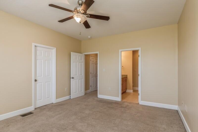513 Arbor Lake Drive, Unit 513 Crestview, FL 32536 - Photo 20 of 37 a view of an empty room and a ceiling fan