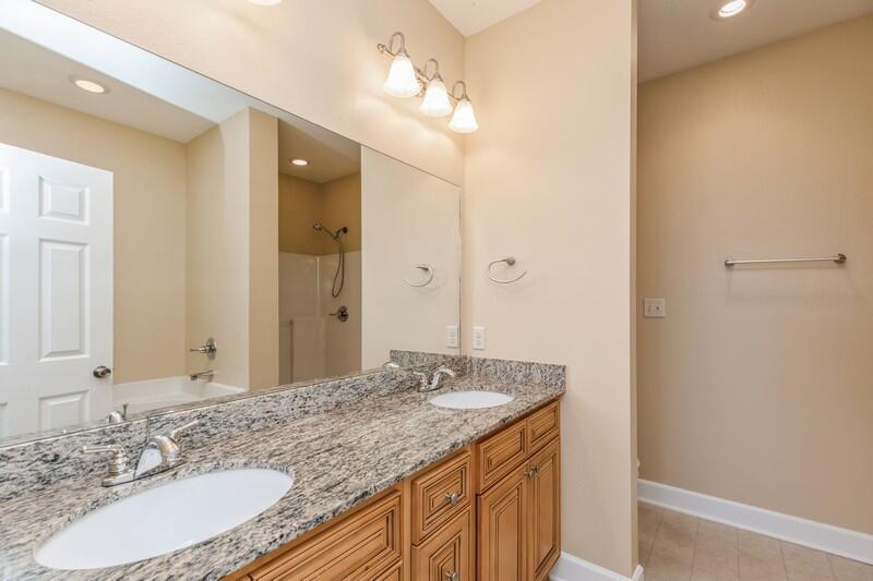 513 Arbor Lake Drive, Unit 513 Crestview, FL 32536 - Photo 22 of 37 a bathroom with a granite countertop sink and a mirror