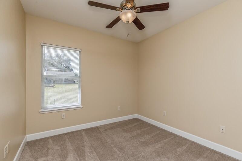 513 Arbor Lake Drive, Unit 513 Crestview, FL 32536 - Photo 27 of 37 an empty room with a window and a fan