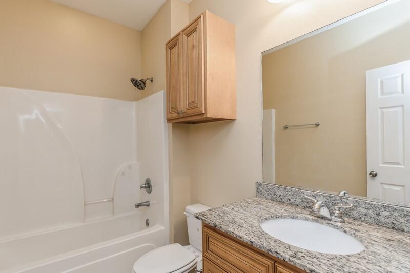 513 Arbor Lake Drive, Unit 513 Crestview, FL 32536 - Photo 29 of 37 a bathroom with a granite countertop sink toilet and shower