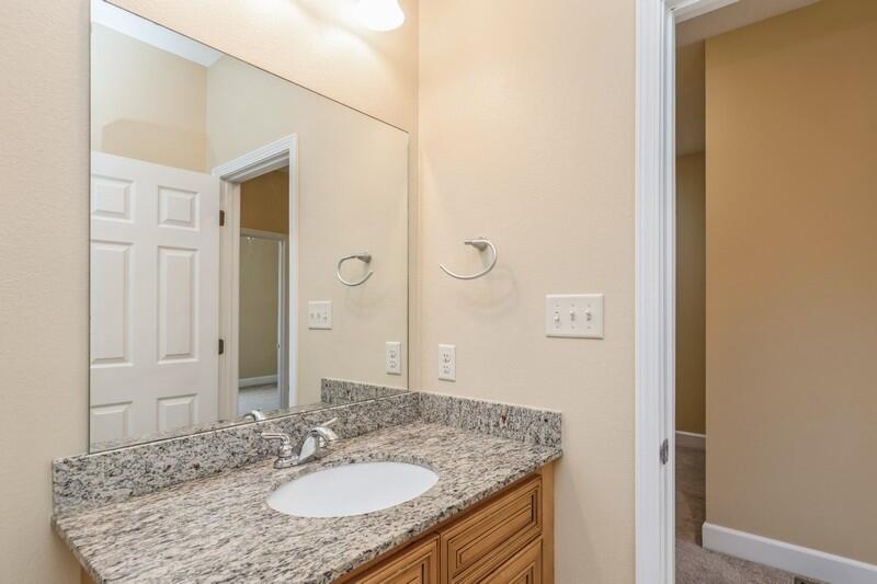 513 Arbor Lake Drive, Unit 513 Crestview, FL 32536 - Photo 30 of 37 a bathroom with a granite countertop sink and a mirror