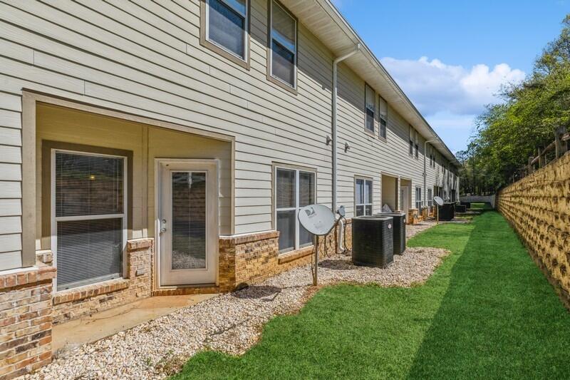 513 Arbor Lake Drive, Unit 513 Crestview, FL 32536 - Photo 4 of 37 a view of a house with backyard and a garden