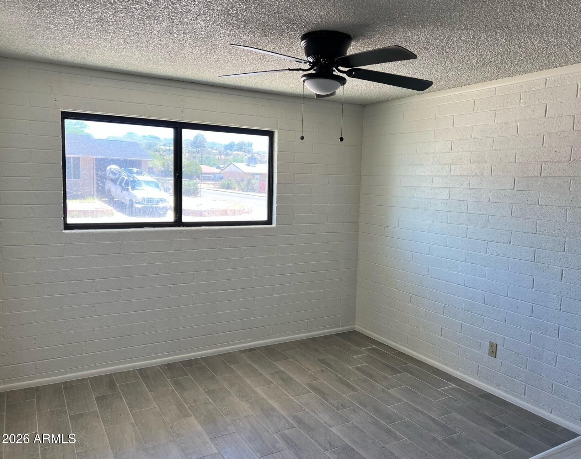 401 Greenwich Road Kearny, AZ 85137 - Photo 14 of 25 a view of an empty room with a window