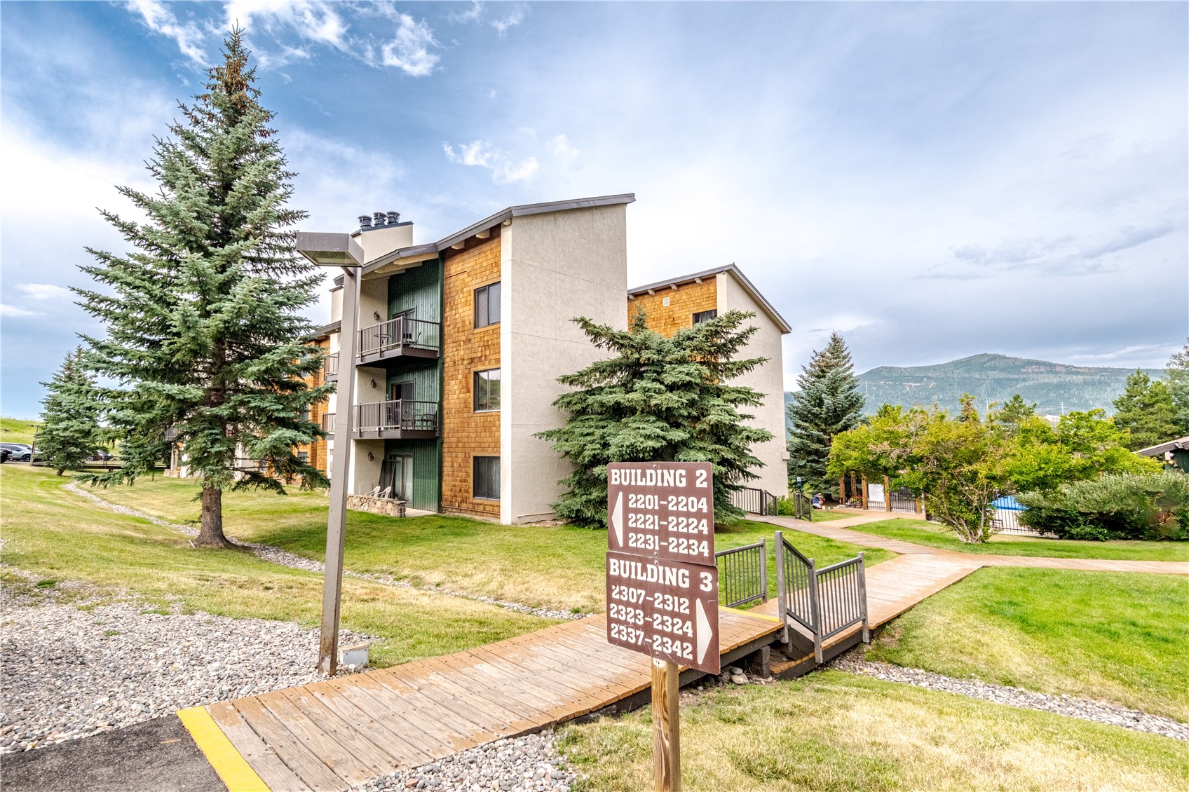 1945 Cornice Road, Unit 2221 Steamboat Springs, CO 80487 - Photo 15 of 24 a view of a house with backyard and sitting area