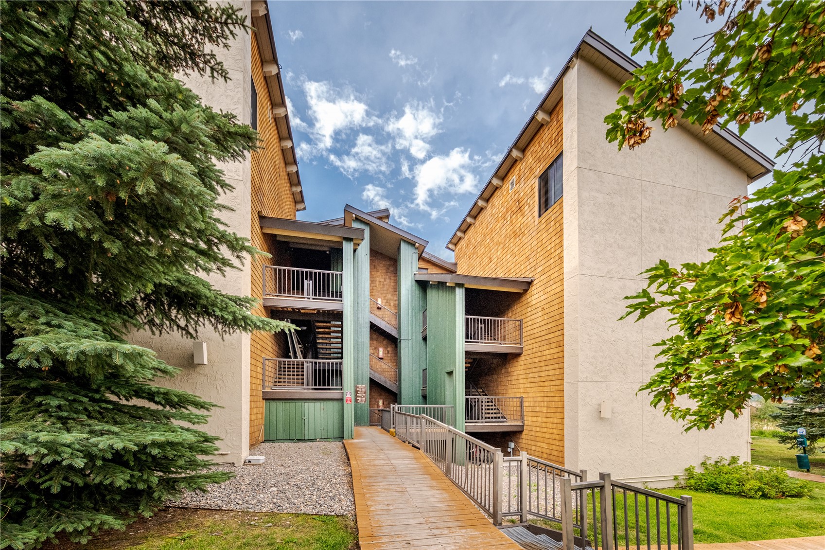 1945 Cornice Road, Unit 2221 Steamboat Springs, CO 80487 - Photo 16 of 24 a front view of a house with a yard
