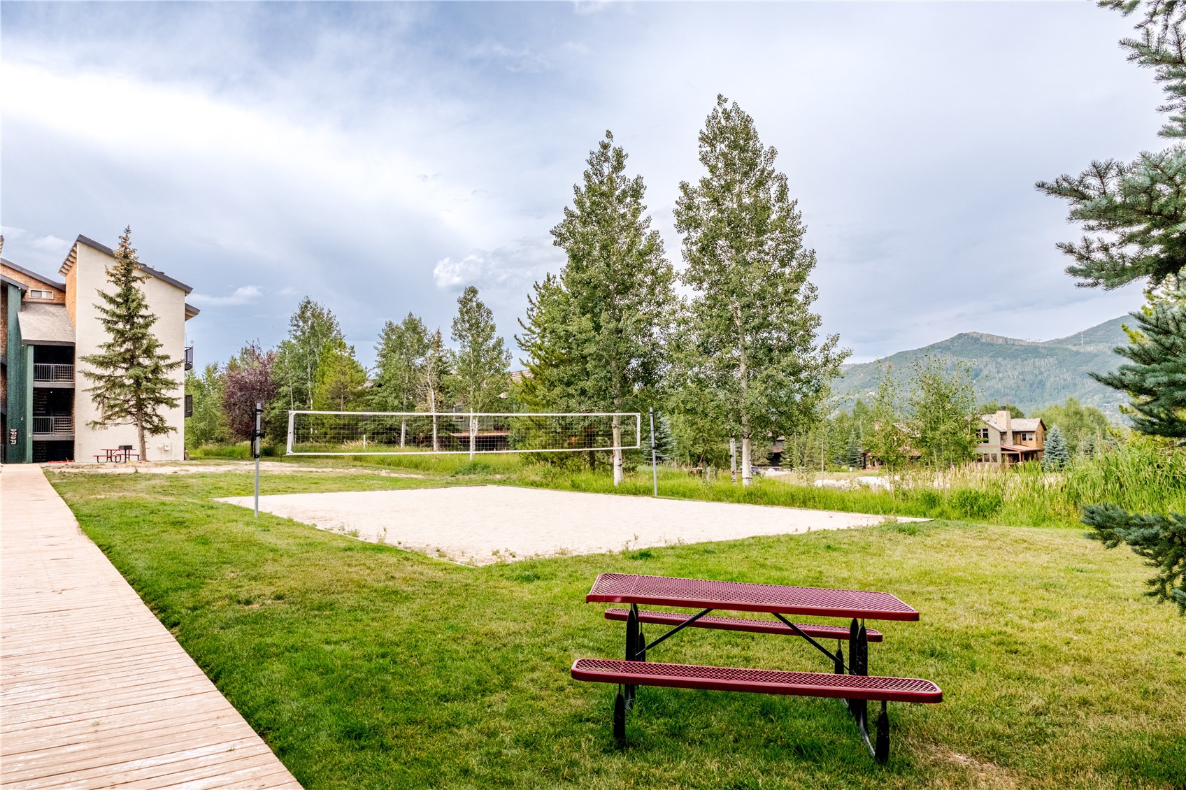1945 Cornice Road, Unit 2221 Steamboat Springs, CO 80487 - Photo 19 of 24 a park view with a bench and trees