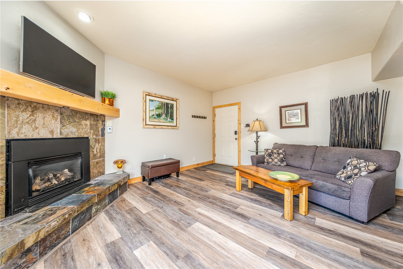 1945 Cornice Road, Unit 2221 Steamboat Springs, CO 80487 - Photo 4 of 24 a living room with furniture and a fireplace