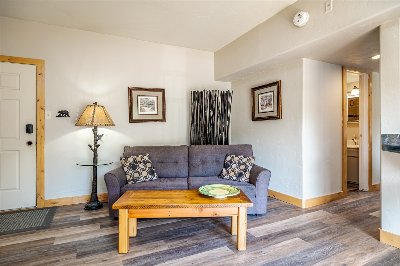 1945 Cornice Road, Unit 2221 Steamboat Springs, CO 80487 - Photo 5 of 24 a bedroom with a bed and wooden floor