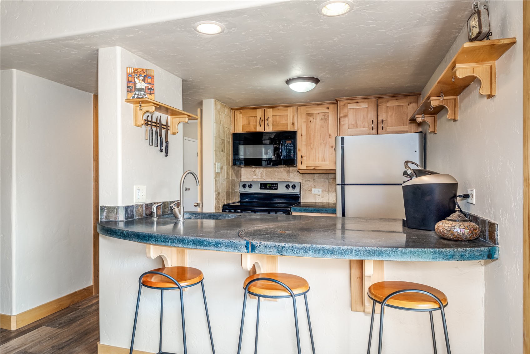 1945 Cornice Road, Unit 2221 Steamboat Springs, CO 80487 - Photo 10 of 24 a kitchen with stainless steel appliances granite countertop a sink and a stove