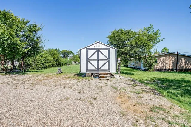 a view of backyard with green space