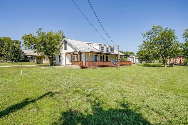 a view of a house with a big yard