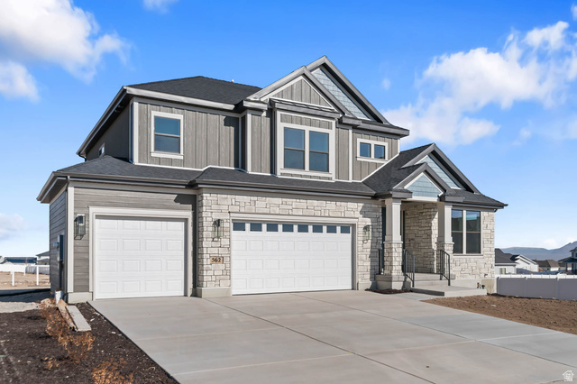 562 West Coyote Rdg Road Grantsville, UT 84029 - Photo 3 of 27 Contemporary two-story residence with a stone and siding exterior