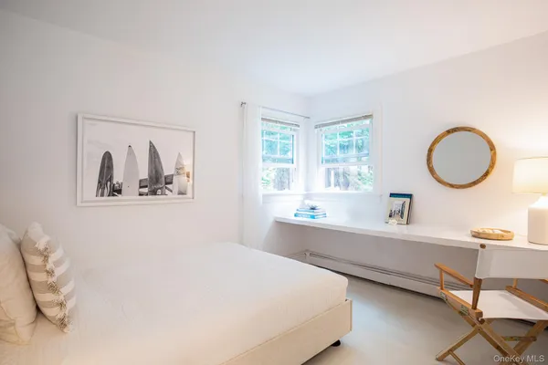 a room with a bed and a furniture