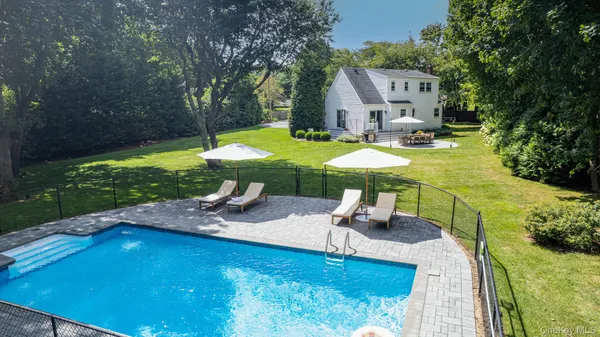 a view of a swimming pool with a patio