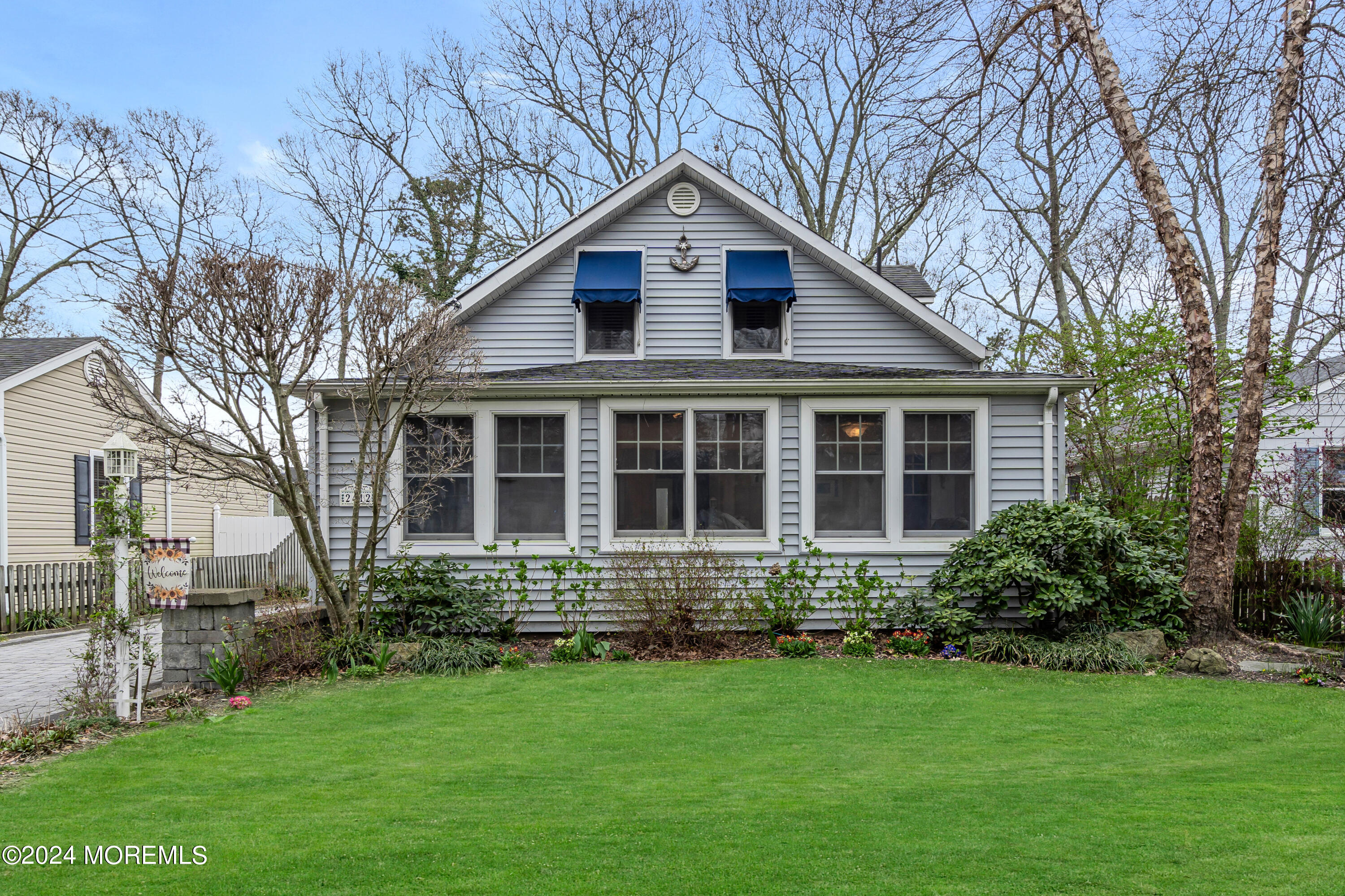2412 Dunkle Road Point Pleasant, NJ 08742 - Photo 1 of 51 a front view of a house with a garden