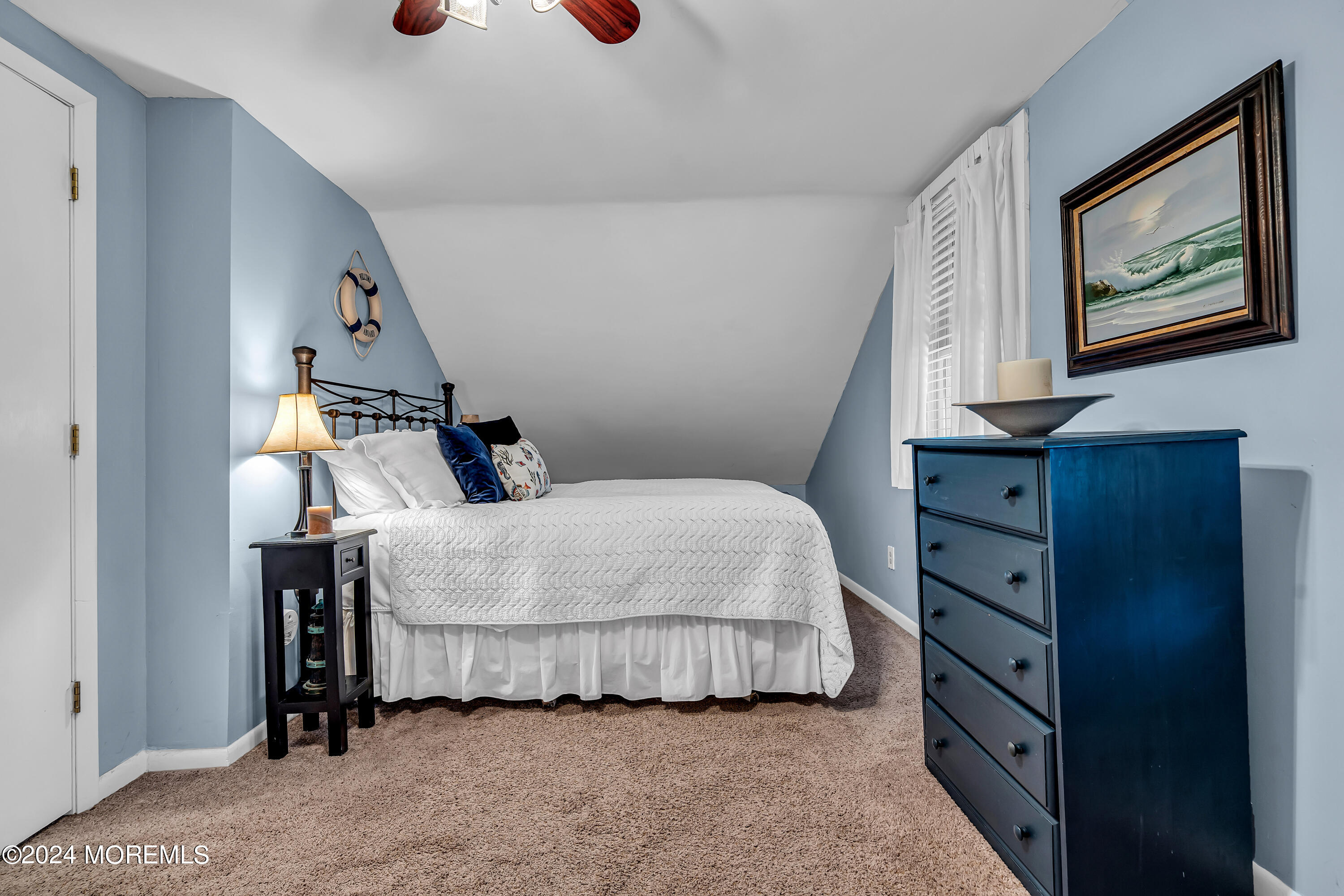2412 Dunkle Road Point Pleasant, NJ 08742 - Photo 30 of 51 a bedroom with a bed and wooden floor